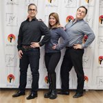 a wedding dance couple with their dance instructor.